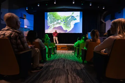 people sitting in the theatre at the Yukon Beringia Interpretive Centre